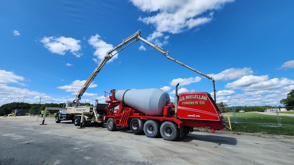 Concrete pump truck delivers concrete to the commercial solar installation site