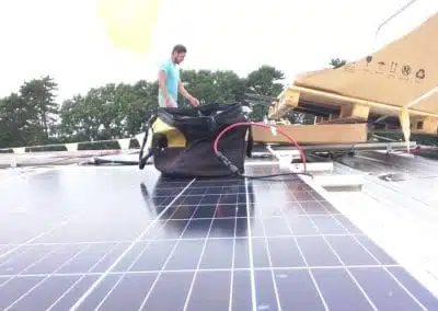 image of man installing commercial solar panels
