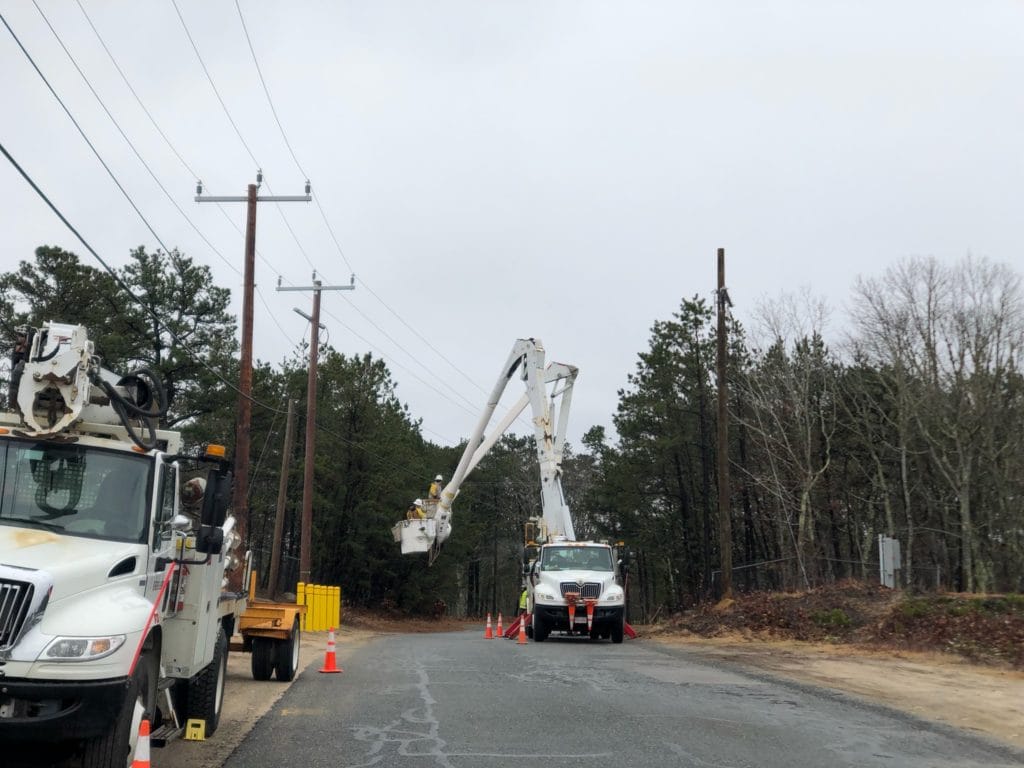 Utility workers working on electrical lines