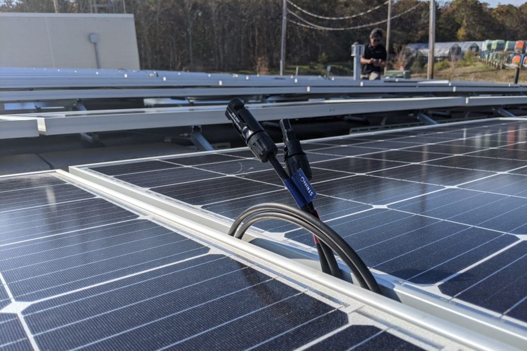 Picture shows close-up of solar panels partially installed