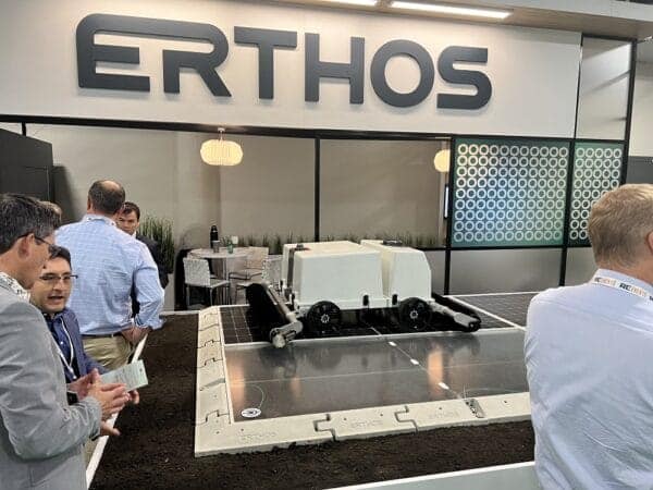 Erthos shows off its solar panel cleaning robot at a renewable energy convention.