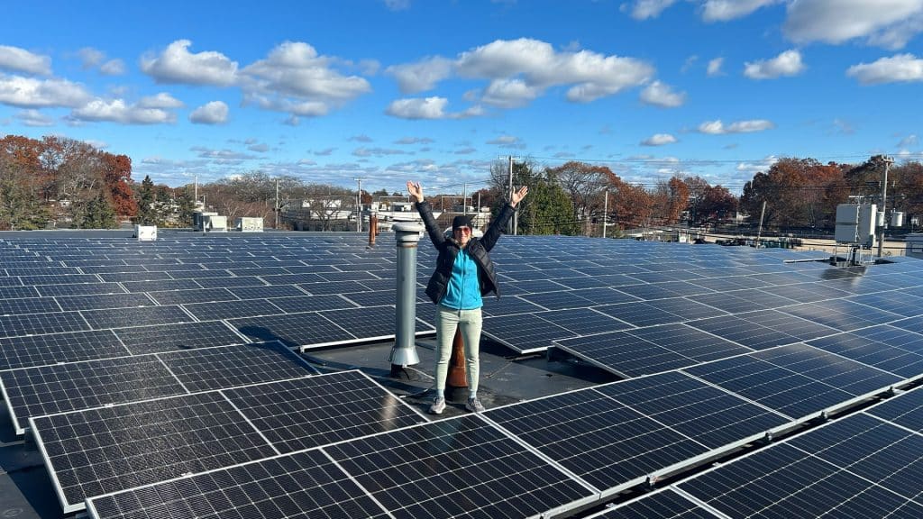 A photo of a very proud team member of Commercial Solar Guy doing an excited project walk through on a beautiful winter afternoon!