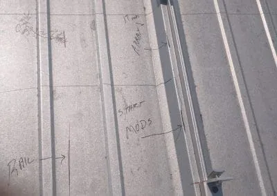 Photo of measurements written in pencil on the rooftop to ensure we place the bolts in the perfect spots