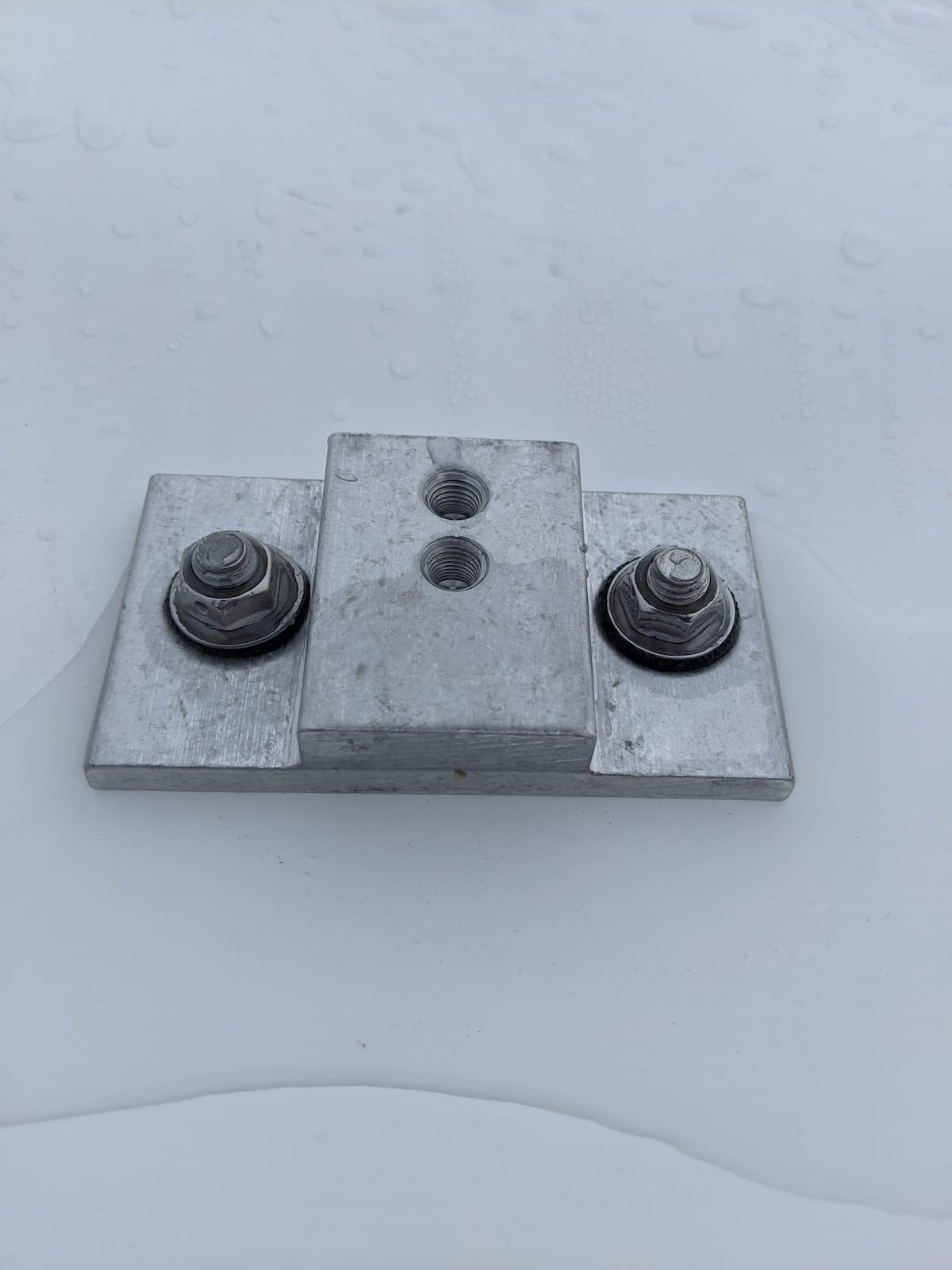 Solar installation flashing hardware on TPO roof