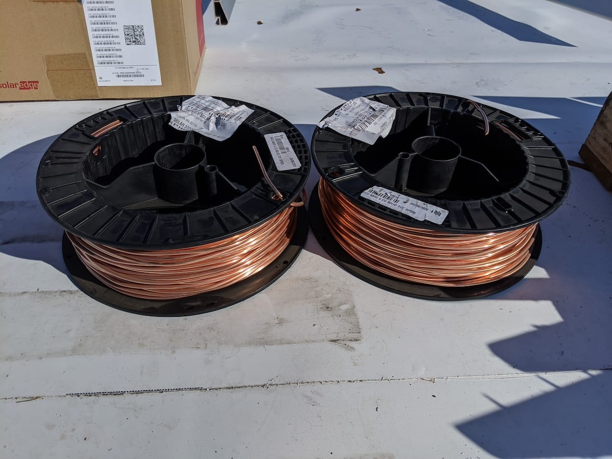 Two rolls of copper wiring used to ground the commercial solar install