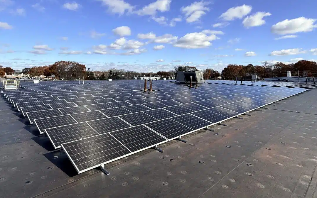 A photo of the 279-kW commercial rooftop solar installation on the NEIEP building in Warwick, Rhode Island on a sunny day in late autumn.